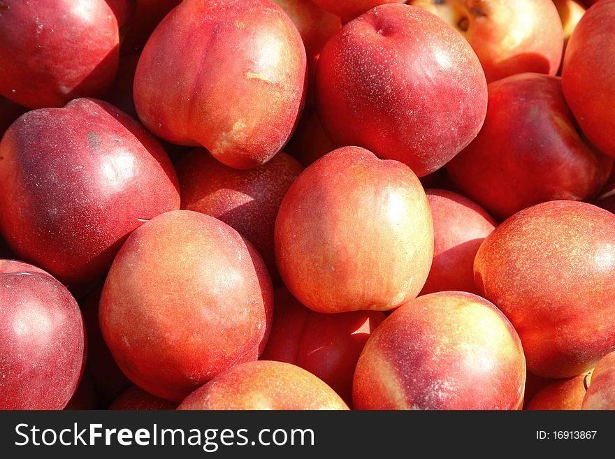 Juicy, fresh peaches are on the table. Juicy, fresh peaches are on the table