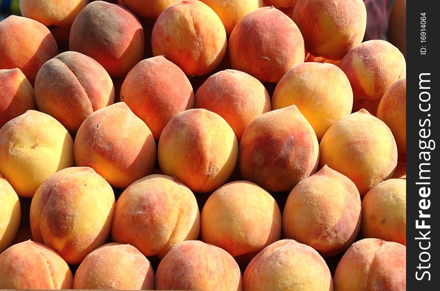 Juicy, fresh peaches are on the table. Juicy, fresh peaches are on the table