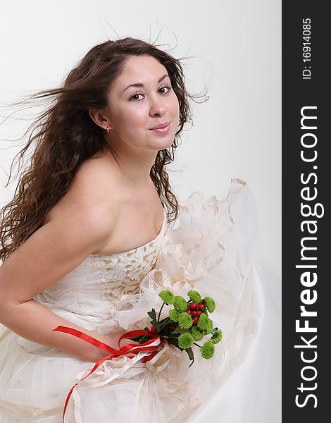 Portrait of the smiling bride in wedding dress. Portrait of the smiling bride in wedding dress