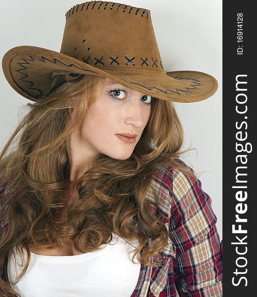 Attractive girl in a cowboy hat with long hair. Attractive girl in a cowboy hat with long hair