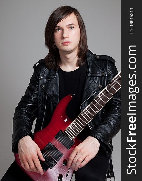 GUITARIST isolated on gray background