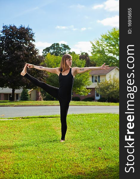 Young girl doing yoga exercise alone