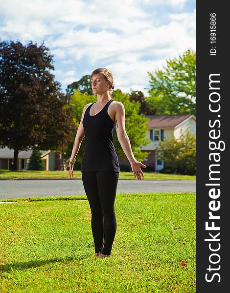 Young girl doing yoga exercise alone