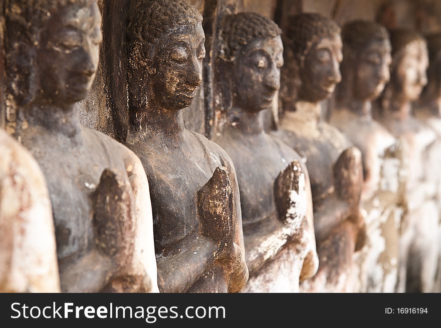 A row of buddha statue at Thailand Temple