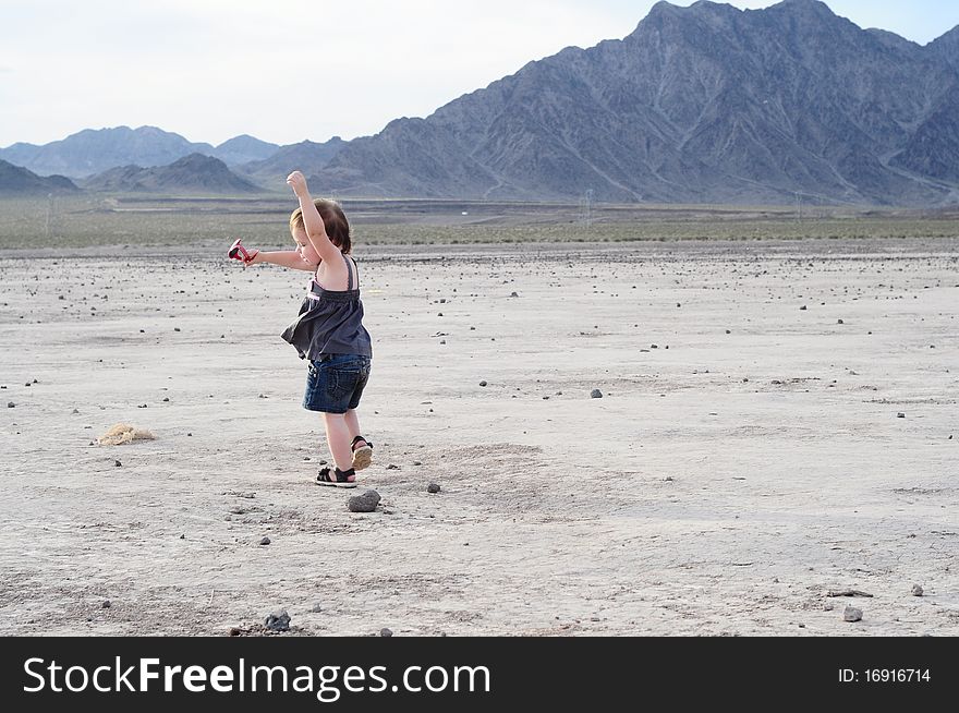 Little Girl Dancing In Desert