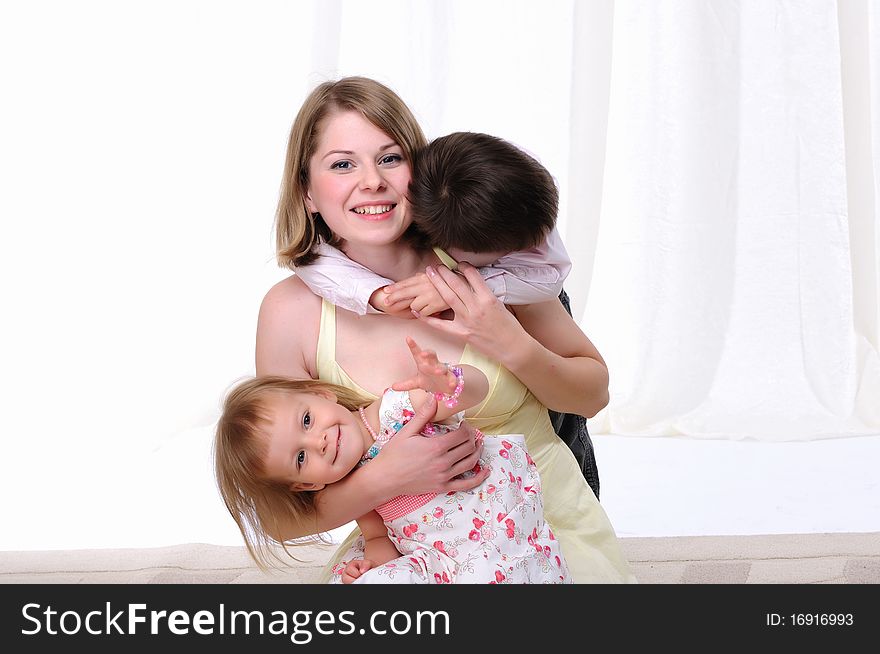 Mom, her son and her little daughter together having fun