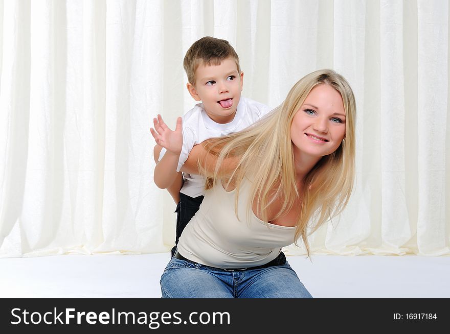 Young mother and son having fun together