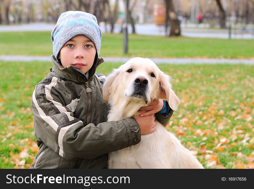 Boy Playing In Autumn Park