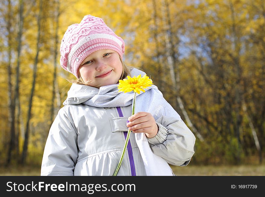 Little Girl With A Yellow Flower