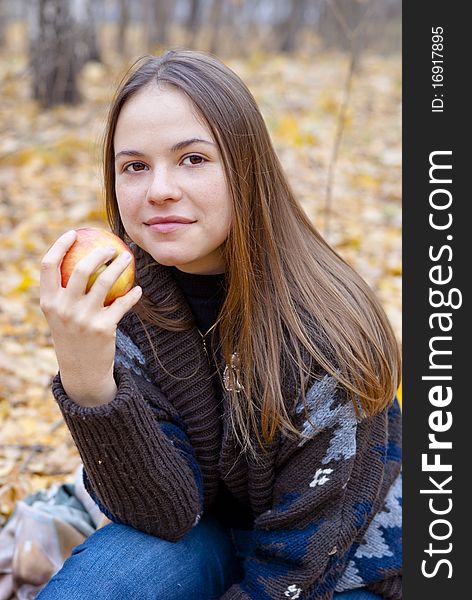 Portrait Of Brown-haired Girl With Apple