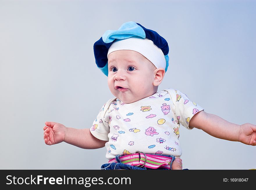 Amusing baby boy in a beret