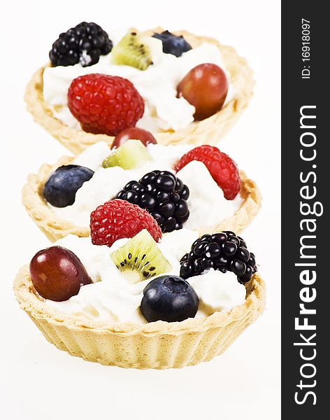 Cakes with fresh fruits and cream. Cakes with fresh fruits and cream