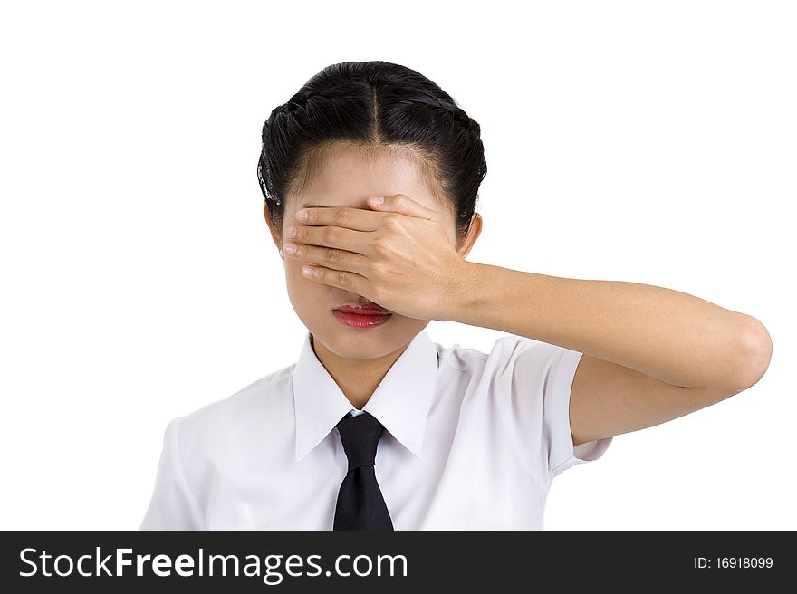 Young businesswoman covering her eyes with one hand, isolated on white background
