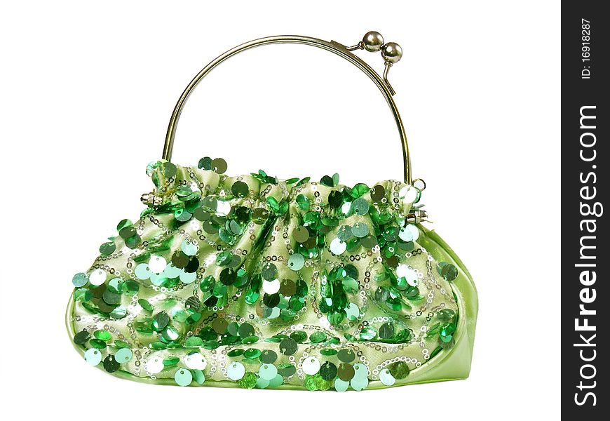 Green handbag with shiny items isolated on white