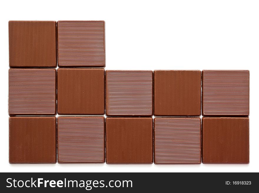 Pieces of chocolate on a white background. Pieces of chocolate on a white background