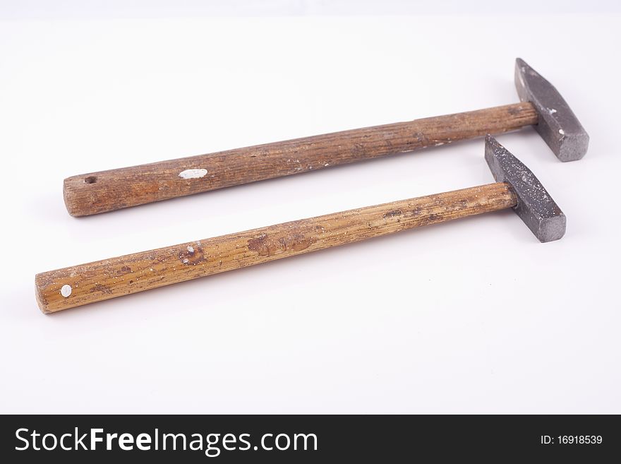 Old used small rusty hammers isolated on white background. Old used small rusty hammers isolated on white background.