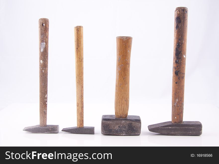 Old used small rusty hammers isolated on white background. Old used small rusty hammers isolated on white background.