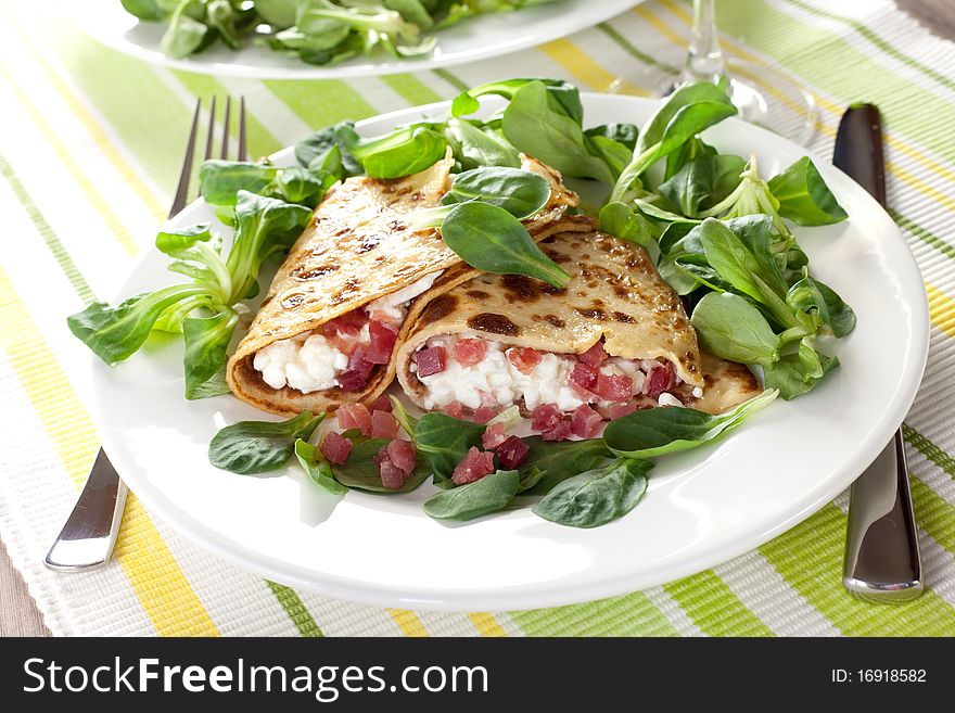 Filled crepe with cottage cheese and ham. Filled crepe with cottage cheese and ham