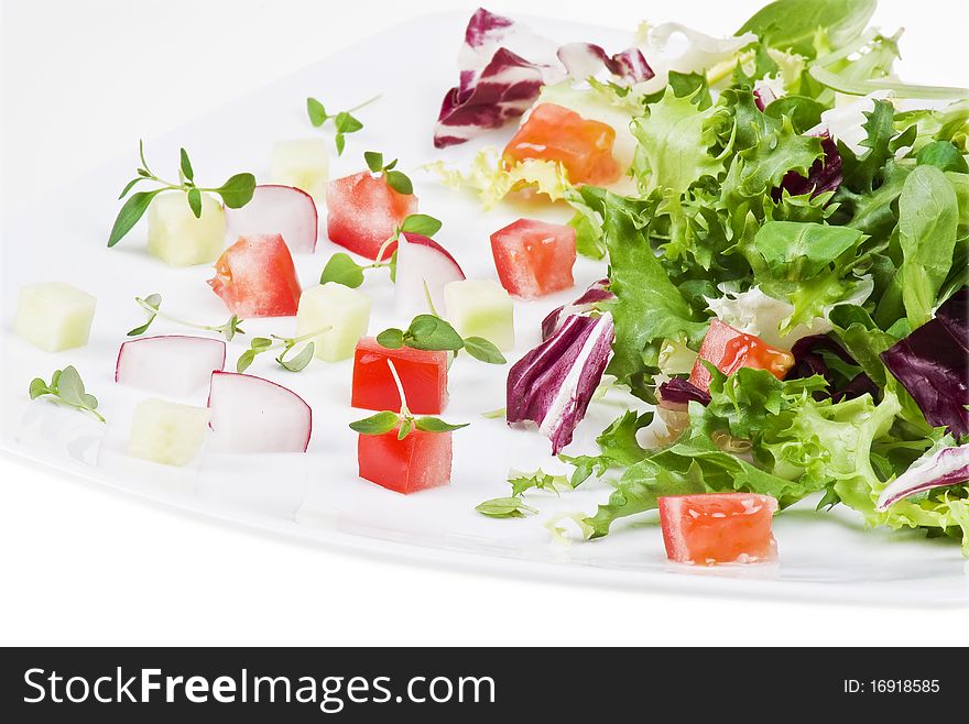 Various salad leaves with tomato, radish and cucumber. Various salad leaves with tomato, radish and cucumber