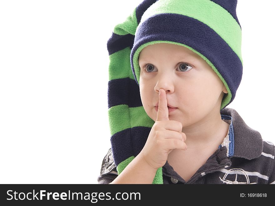 Boy in green cap holds his finger near the mouse on a white background. Boy in green cap holds his finger near the mouse on a white background