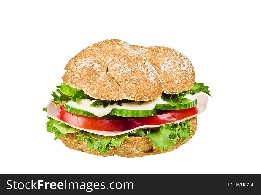 Fresh sandwich with ham and vegetables over white background. Fresh sandwich with ham and vegetables over white background