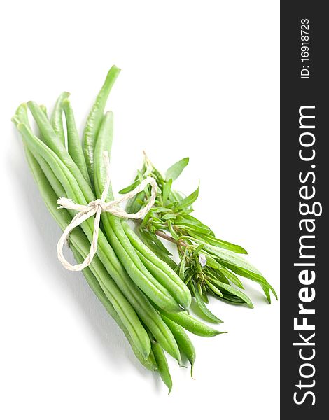 Green beans and savory isolated on white background