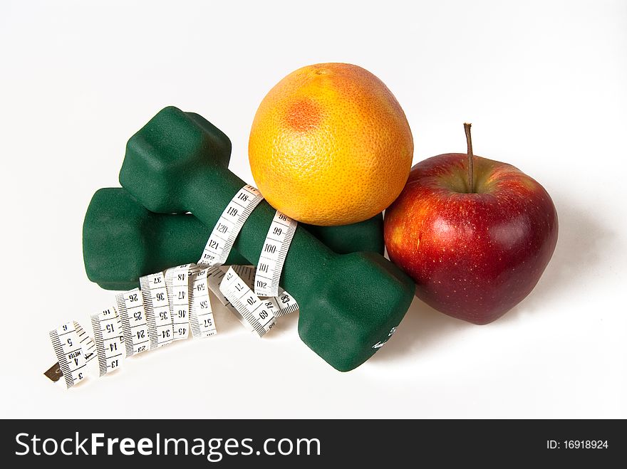 Dumbells Wrapped In Measure Tape With Fruits