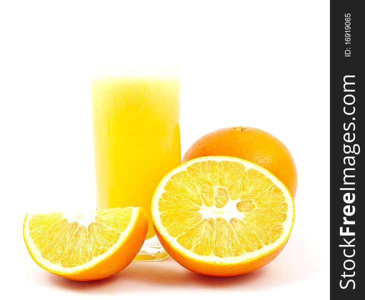 Cup fresh-squeezed orange juice and oranges on a white background