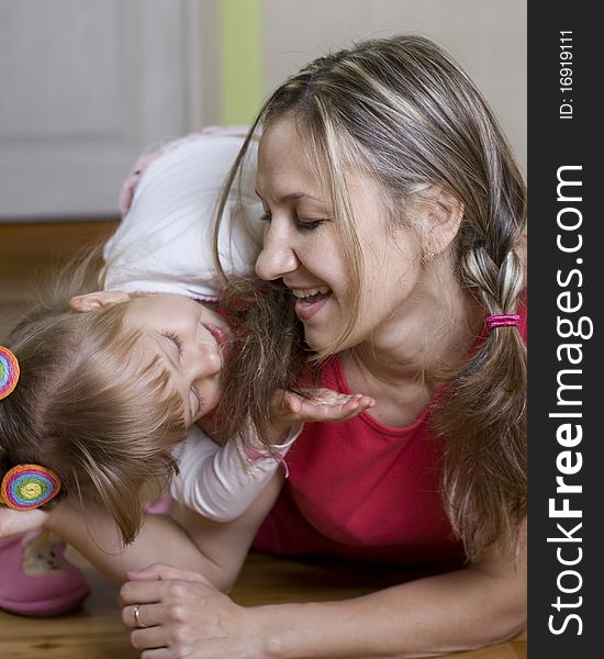 Happy Mom Plays With Her Daughter