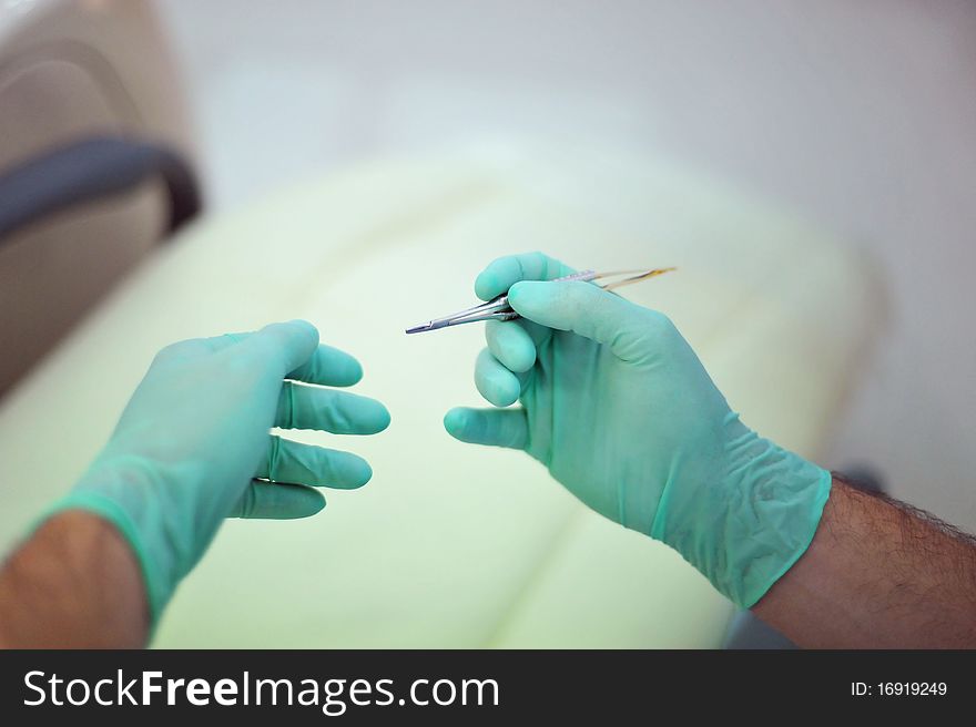 A stomatology medic's hands can be seen in a private clinic in Bucharest,Romania.