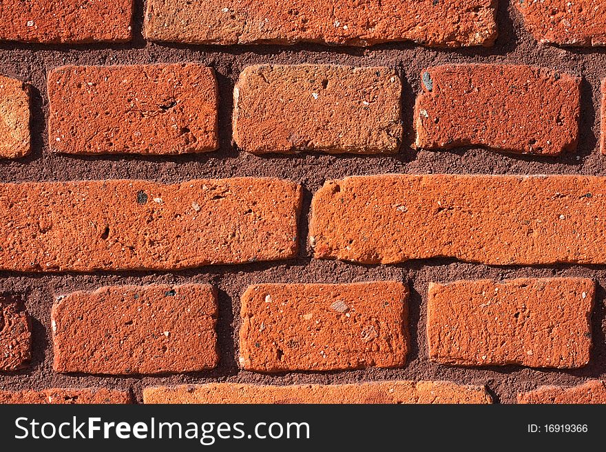 Red bricks background close up