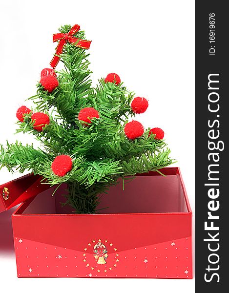 Red gift box and christmas tree on isolated background