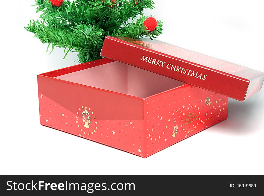 Red gift box and christmas tree on isolated background