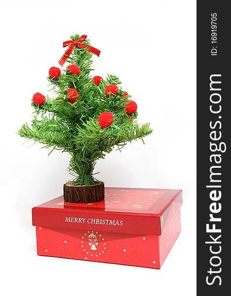 Red gift box and christmas tree on isolated background