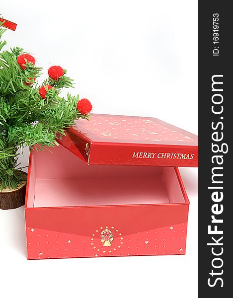 Red gift box and christmas tree on isolated background