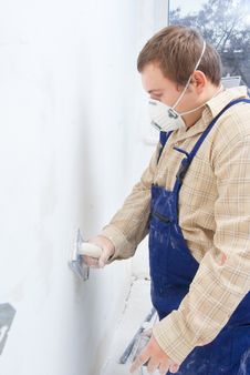 Builder Polishing The Wall. Royalty Free Stock Photo Builder Polishing The Wall. Royalty Free Stock Photo