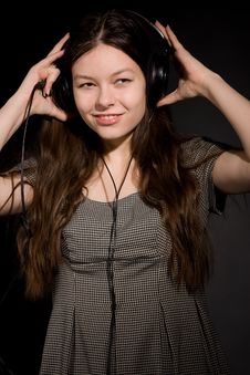Girl In Headphones Listening Music Stock Images
