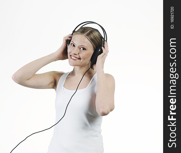 Young woman listening music with headphones