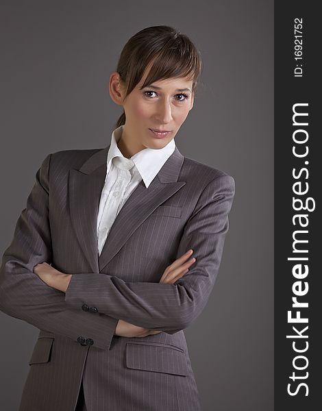 Portrait of business woman over grey background