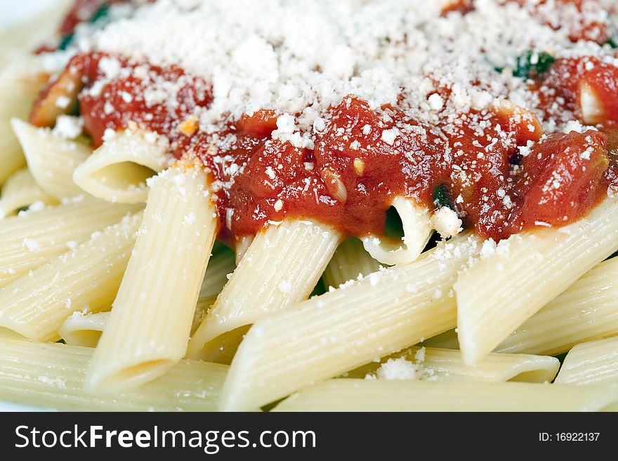 Pasta with tomato sauce and grated parmesan. Pasta with tomato sauce and grated parmesan