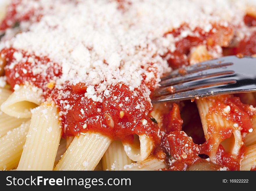 Pasta with tomato sauce and grated parmesan. Pasta with tomato sauce and grated parmesan