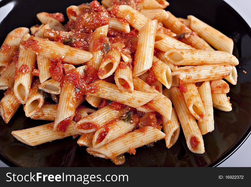 Pasta with tomato sauce and grated parmesan. Pasta with tomato sauce and grated parmesan