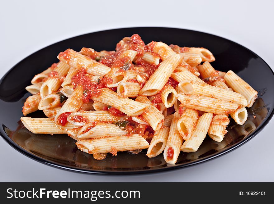 Pasta with tomato sauce and grated parmesan. Pasta with tomato sauce and grated parmesan