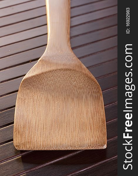 Wooden spoon - used as a tool for cooking.