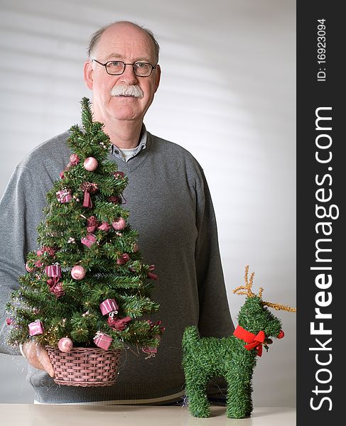 Senior Man With Christmas Decoration
