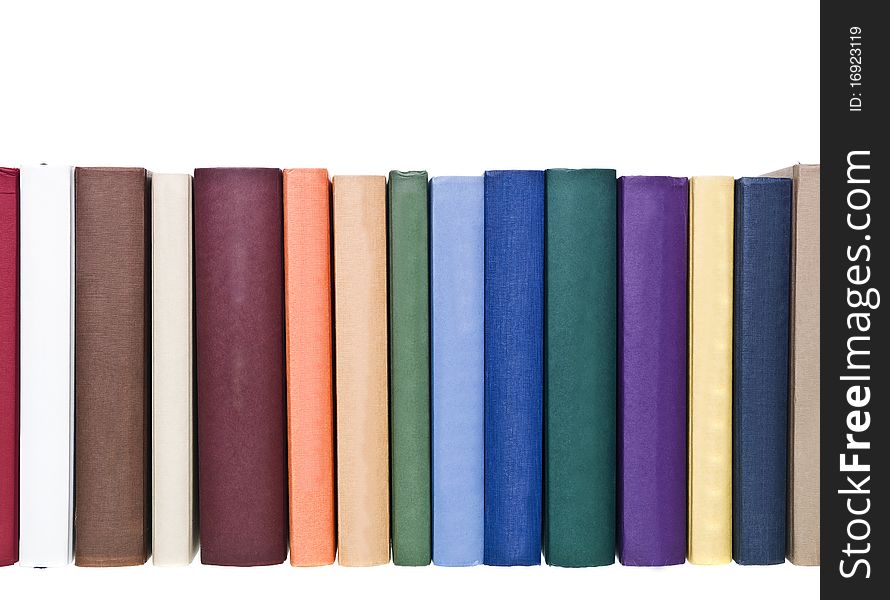 Books in a row isolated on white background