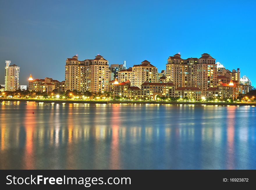 Apartments by the river at night