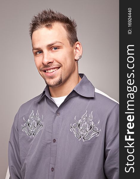 Portrait of smiling handsome man on gray background. Portrait of smiling handsome man on gray background