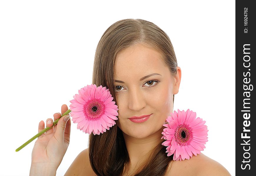 Beautiful woman with pure healthy skin and long hair smelling 2 pink flowers. isolated on white background. Beautiful woman with pure healthy skin and long hair smelling 2 pink flowers. isolated on white background