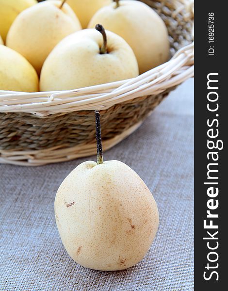 Beautiful ripe pears on a wooden table